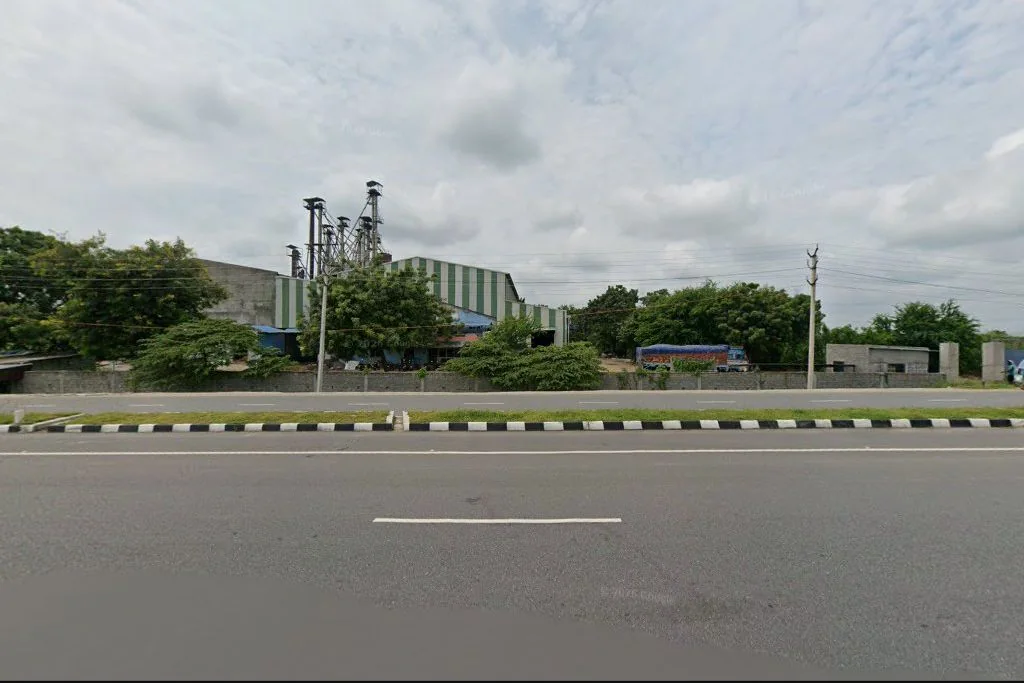 Street-level exterior view of the Sai Laxmi rice facility near Acharlagudem